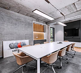 Meeting and conference table chairs with a minimalist, wrap-around design